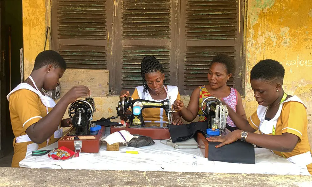 Women working a sewing machine